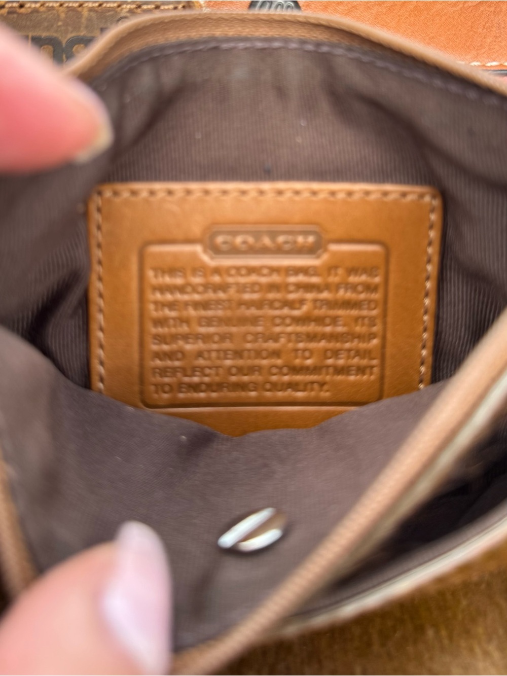 Coach tan cow hide crossbody bag